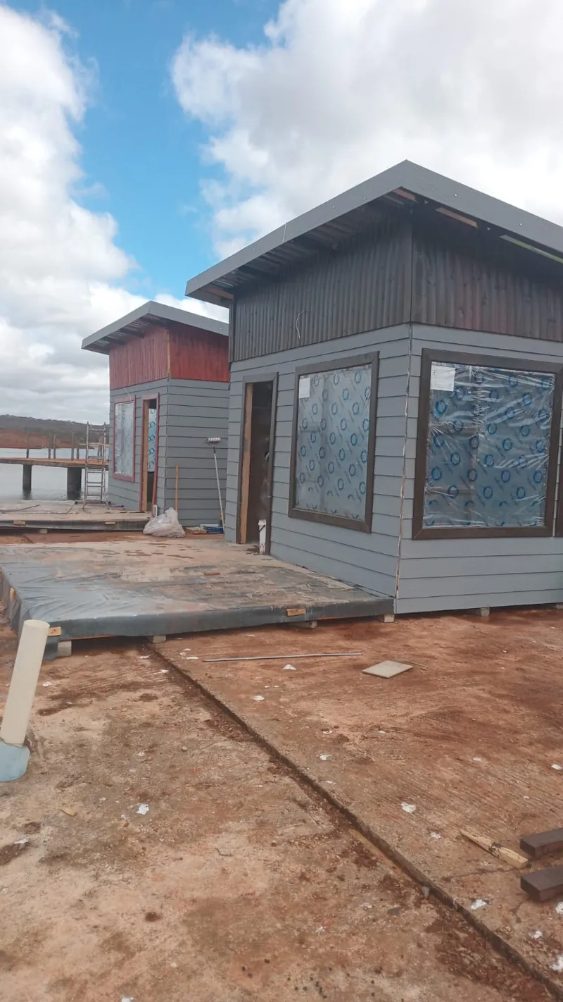 Grey flat-roof Nutec unit with dark timber cladding