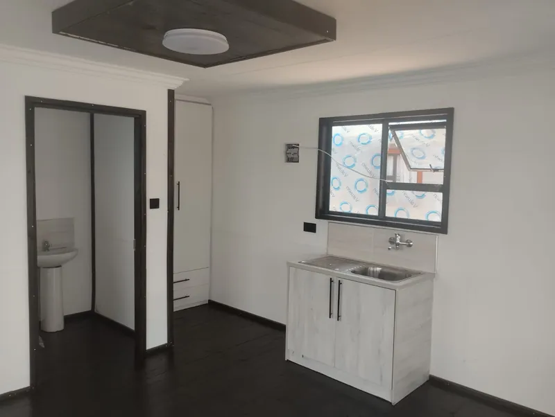 Kitchenette unit and bathroom door