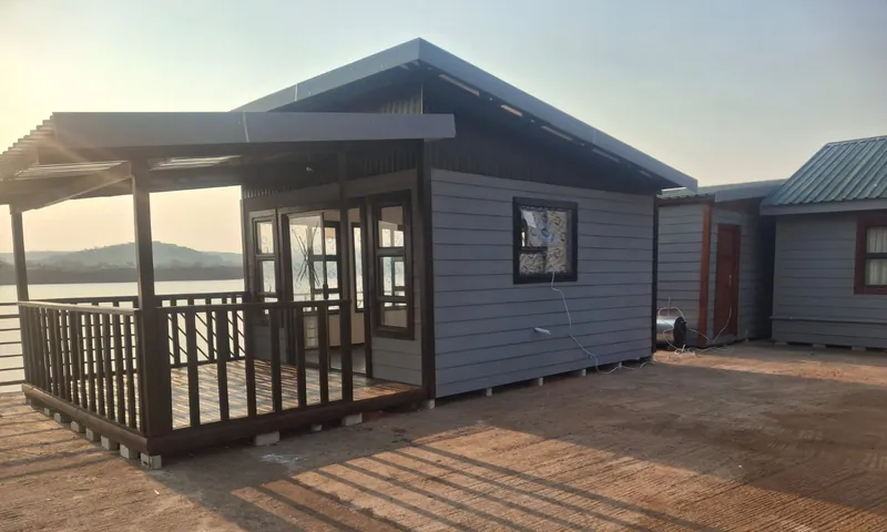 Grey Nutec unit with a covered timber deck and railing