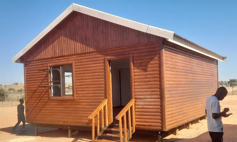 Log-look wooden house with timber steps