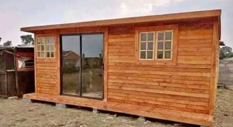 Stained timber Wendy house with a glass sliding door